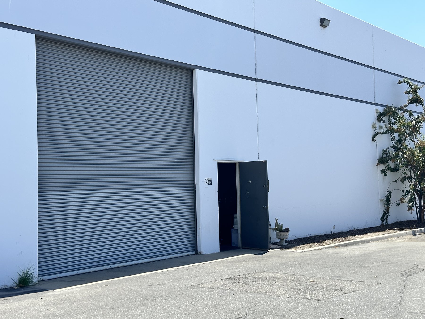 Ground level roll-up door serving the 9,100 SF dead storage area
