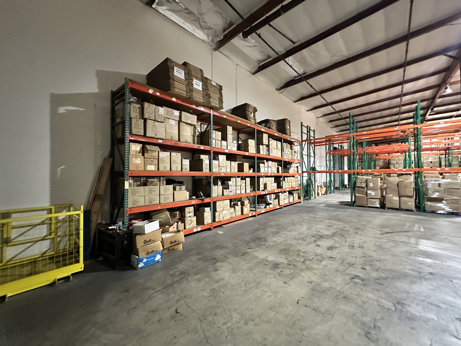 Racked storage bays stocked with palletized inventory