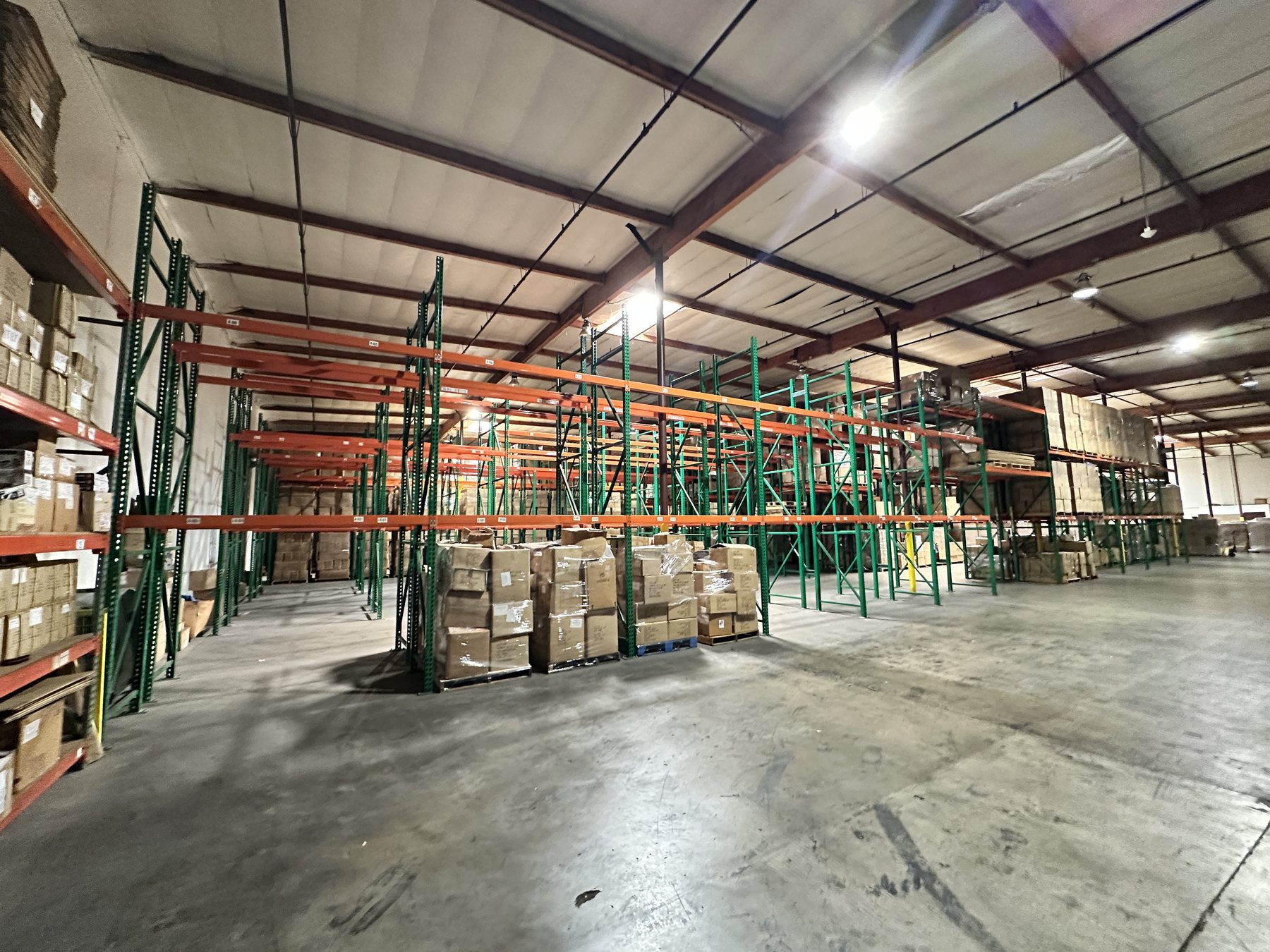 Wide view down the racking aisles of the 65 by 140 foot storage rectangle